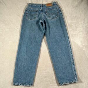 Vintage 90s Levis 560 Loose Fit Tapered Leg Jeans Men's 33x32 Medium Wash Blue
